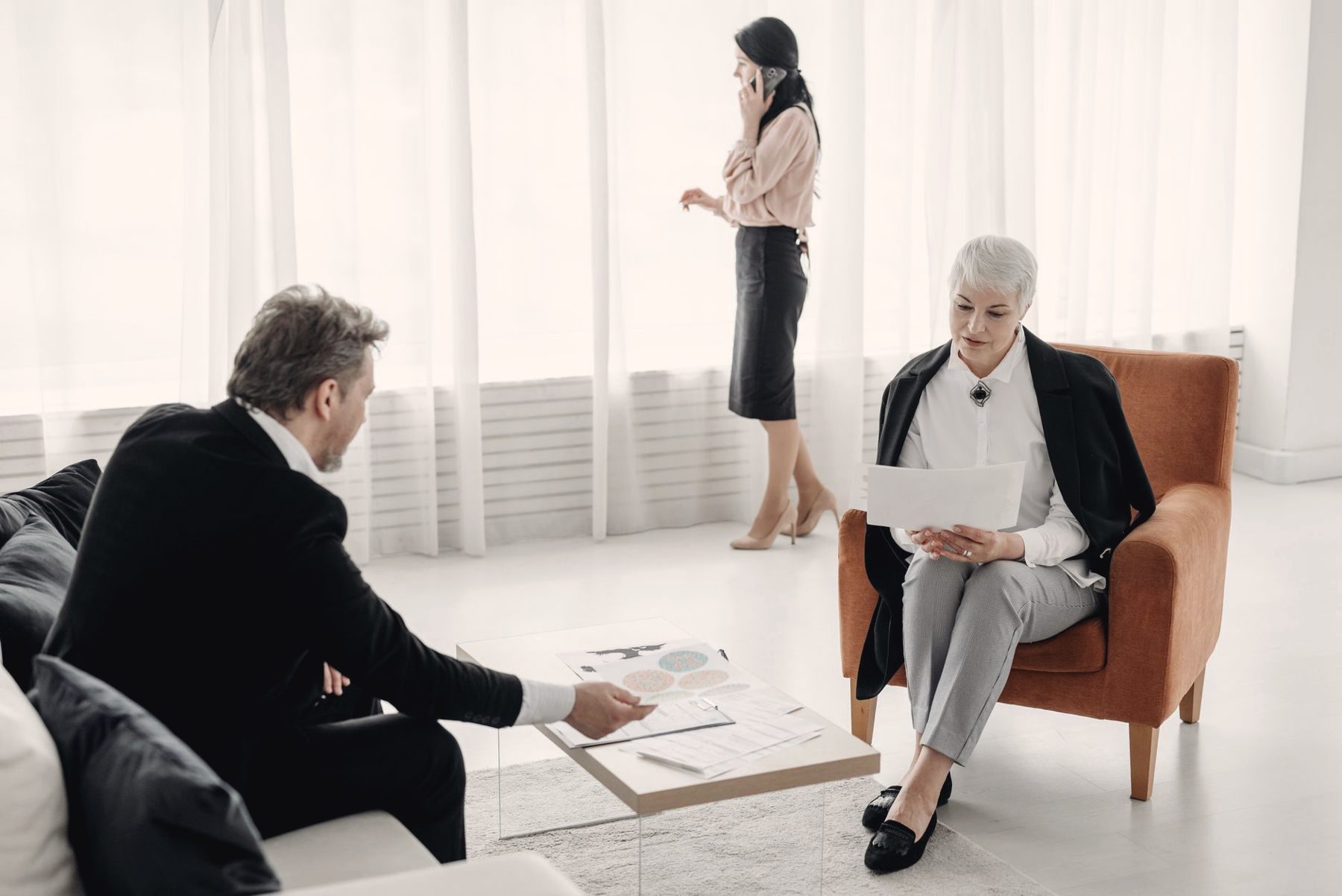 Clients meeting with an advisor in a calm, bright lounge