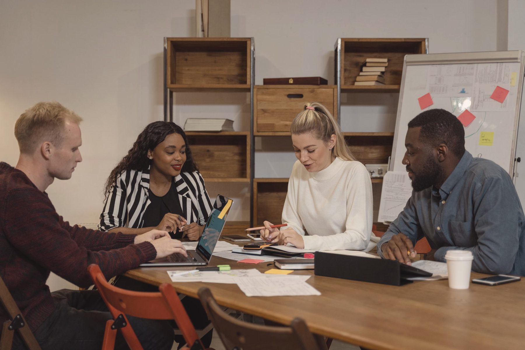 A small team working together around a shared table
